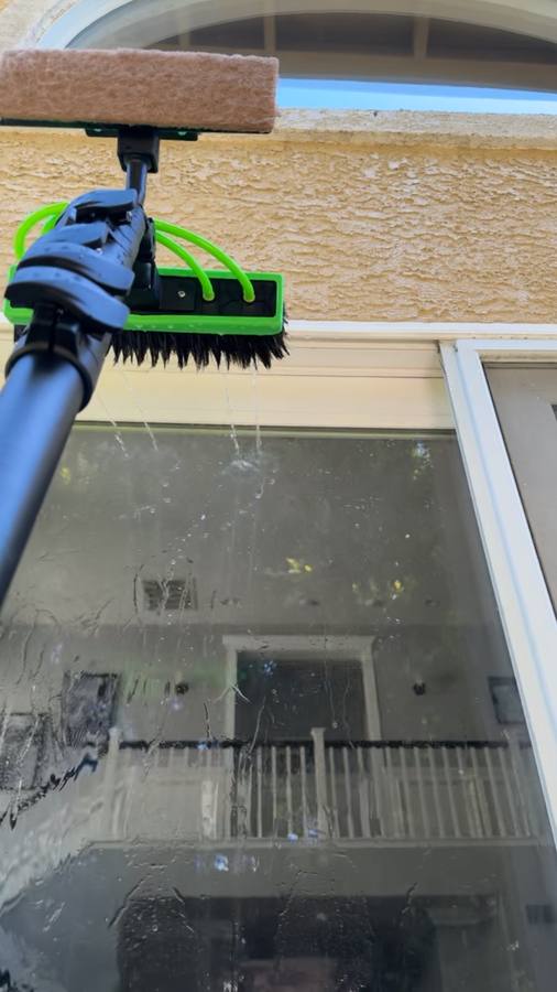 Close-up of the brush head and pure water jets used on glass